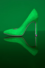 Green shoe. Shoe store. Slipper for a lady. Women's shoes with heels. Evening look. Elegant style.