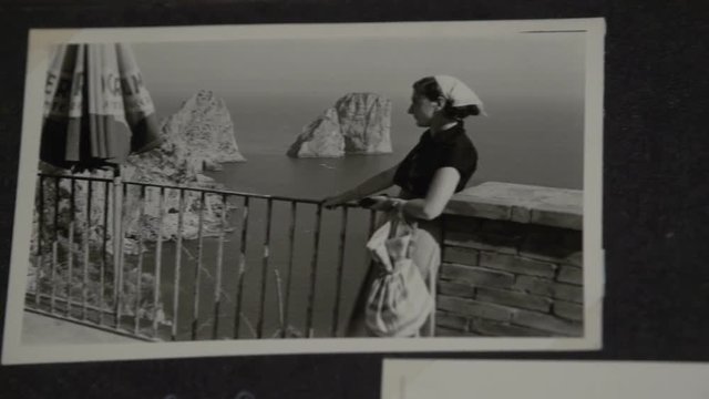 Slow motion foreground overview of some vintage photos at Capri FDV