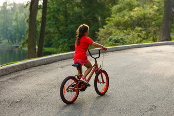 Girl on a bicycle spring morning