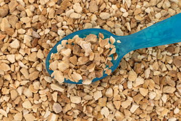 Cut orris root with a spoon close view