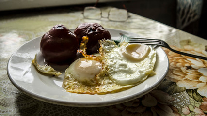  kitchen, apartment, lonely breakfast of scrambled eggs and tomatoes ..
