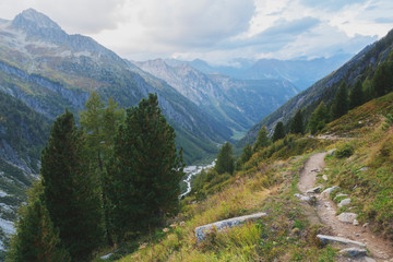 Fototapeta premium Mountains in the Swiss Alps with glaciers, rivers and distant mountain valleys.