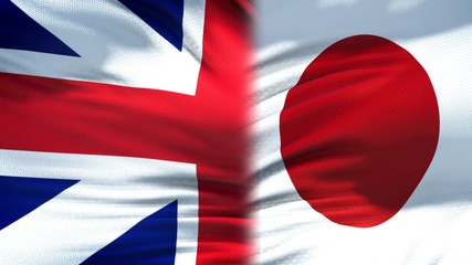 Great Britain and Japan flags background, diplomatic and economic relations