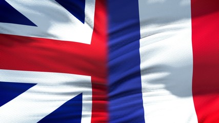 Great Britain and France flags background, diplomatic and economic relations