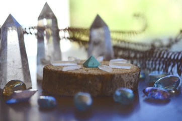 Beautiful, sparkling healing crystals. Witchy crystal grid, wiccan alter set up. Healing energy, shot in natural lighting with low exposure. Crystal Grid, sacred space. Bohemian decorations, romantic 