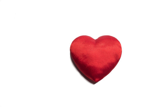 Simple classic red silk handmade heart on white background