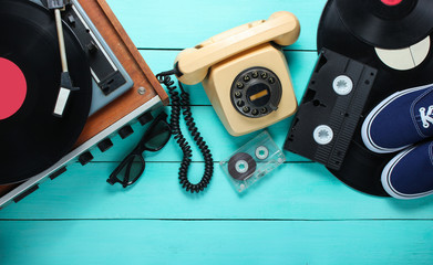 Old-fashioned objects on a blue wooden background. Retro style, 80s, pop culture. Top view