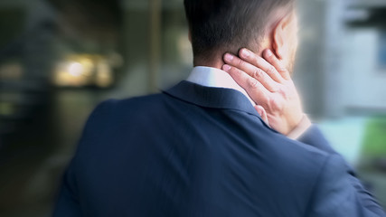 Male suffering from neck pain, sedentary lifestyle, lack of physical activity