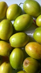 Ziziphus Mauritiana Fruits, Also Known as Chinese Date, Ber, Chinee Apple, Jujube, Indian Plum, Regi Pandu, Indian Jujube, Dunks (in Barbados) and Masau on White Dish Background