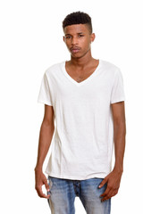 Young handsome African man isolated against white background