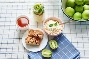 Cheesecakes and cottage cheese with tea. Delicious cheesecake on table. Copy space. Concept of Russian and Ukrainian cuisine. Romantic breakfast. Mother's Day Greeting Card. Healthy food. Women's Day