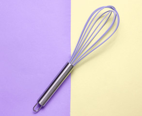 Kitchen corolla on pastel background. Top view, cooking concept, minimalism.