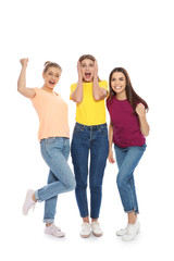Obraz premium Young women celebrating victory on white background