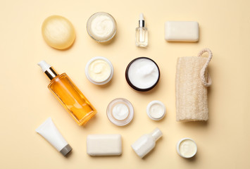 Flat lay composition with body care products on color background