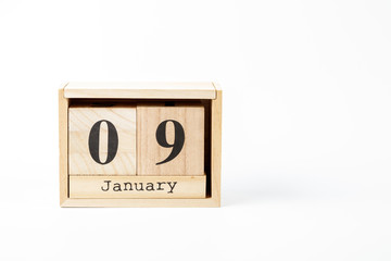 Wooden calendar January 09 on a white background