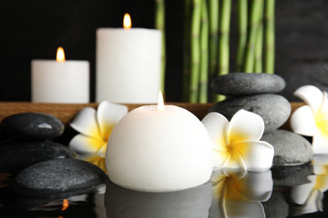 Spa composition with burning candle in water