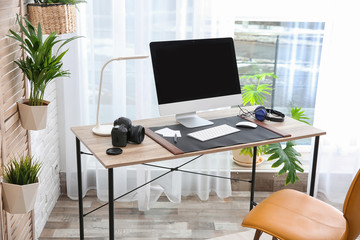 Light modern interior of working place with computer