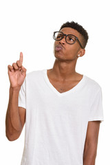Young handsome African man thinking and pointing finger up