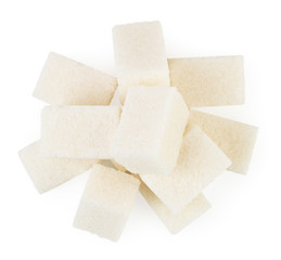 Bunch of refined sugar on a white. The form of the top.
