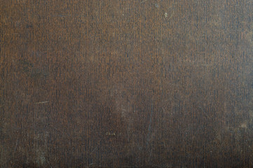 Old suitcase surface. Vintage abstract brown background. Scuffs, scratches.