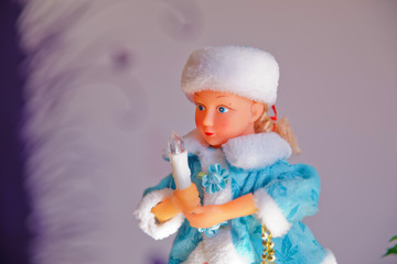 Fototapeta na wymiar New year. Beautiful girl in a long blue coat with white fur. Snow maiden snow maiden , a traditional Russian Christmas character on a white background.