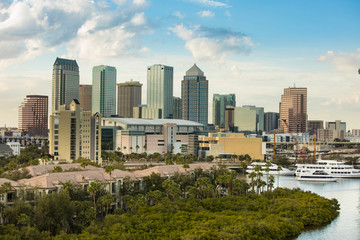 Fototapeta premium Low aerial view of downtown Tampa, Florida, expensive homes, and port