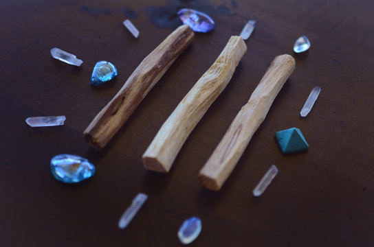 Tumbled healing crystals, shiny bright colors. Rainbow aura quartz, indigo aura quartz, champagne aura quartz, aqua aura crystals. Macro photography with low exposure natural lighting. Crisp colors 