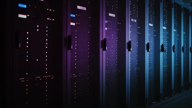 Moving Data Shot of Dark Data Center With Multiple Rows of Fully Operational Server Racks. Modern Telecommunications, Cloud Computing, Artificial Intelligence, Database, Supercomputer. Neon Light