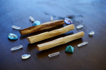 Tumbled healing crystals, shiny bright colors. Rainbow aura quartz, indigo aura quartz, champagne aura quartz, aqua aura crystals. Macro photography with low exposure natural lighting. Crisp colors 