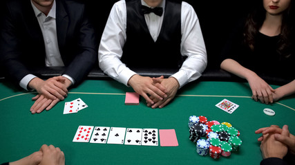 Business people gambling at casino, risky poker game, upper class entertainment