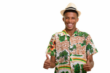 Young happy African man giving thumbs up ready for vacation