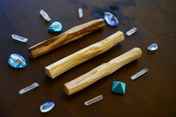 Tumbled healing crystals, shiny bright colors. Rainbow aura quartz, indigo aura quartz, champagne aura quartz, aqua aura crystals. Macro photography with low exposure natural lighting. Crisp colors 