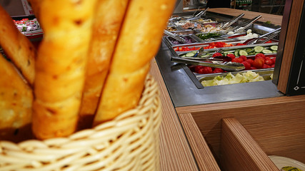 Concept of selling unhealthy food by weight in a store. Vegetables, fruits, meat, salad.