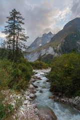 Fototapeta na wymiar Beautiful landscapes of the Alps with rivers and peaks.