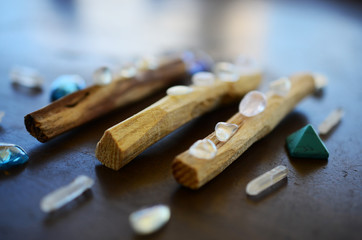 Hipster healing crystal display, bright shiny gems and stones. Witchy crystal healing and meditation. Sacred space, Wiccan alter. Clear quartz, aquaaura, rainbow aura quartz. 