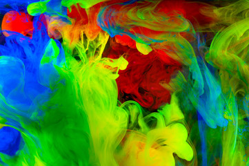 Fototapeta na wymiar Abstraction of multicolored paints in water