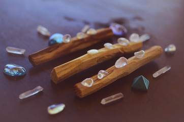 Hipster healing crystal display, bright shiny gems and stones. Witchy crystal healing and meditation. Sacred space, Wiccan alter. Clear quartz, aquaaura, rainbow aura quartz. 