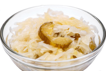 Traditional organic raw and fermented sauerkraut with pickled Persian cucumbers.