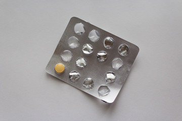 Plate of pills on white background