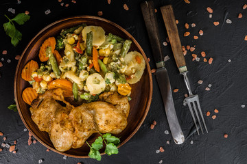 Fried chicken fillet with vegetables.