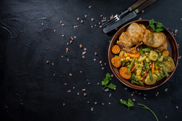 Fried chicken fillet with vegetables.