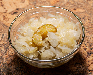 Traditional organic raw and fermented sauerkraut with pickled Persian cucumbers.