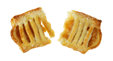Broken pastry with apple filling isolated on a white background.