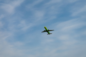 Place flying in sunset sky. Passenger plane on a background of the sky