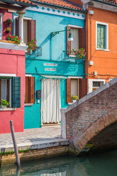 Exterior of colorful houses near canal