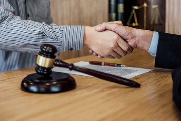 Shaking hands after good cooperation, Businessman handshake male lawyer after discussing good deal of contract, Meeting and collaboration concept