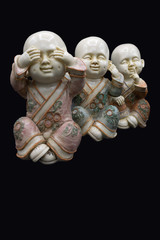 The three wise Buddha are a maxim, embodying the proverbial principle 