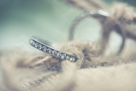 Close up of ring tied in string