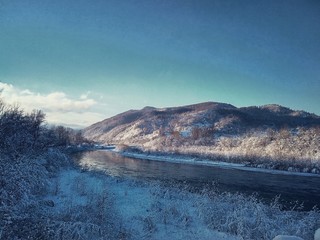 River with ice on a background of mountains