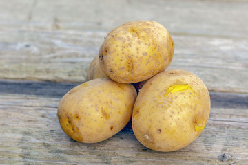 potatoes on wooden background